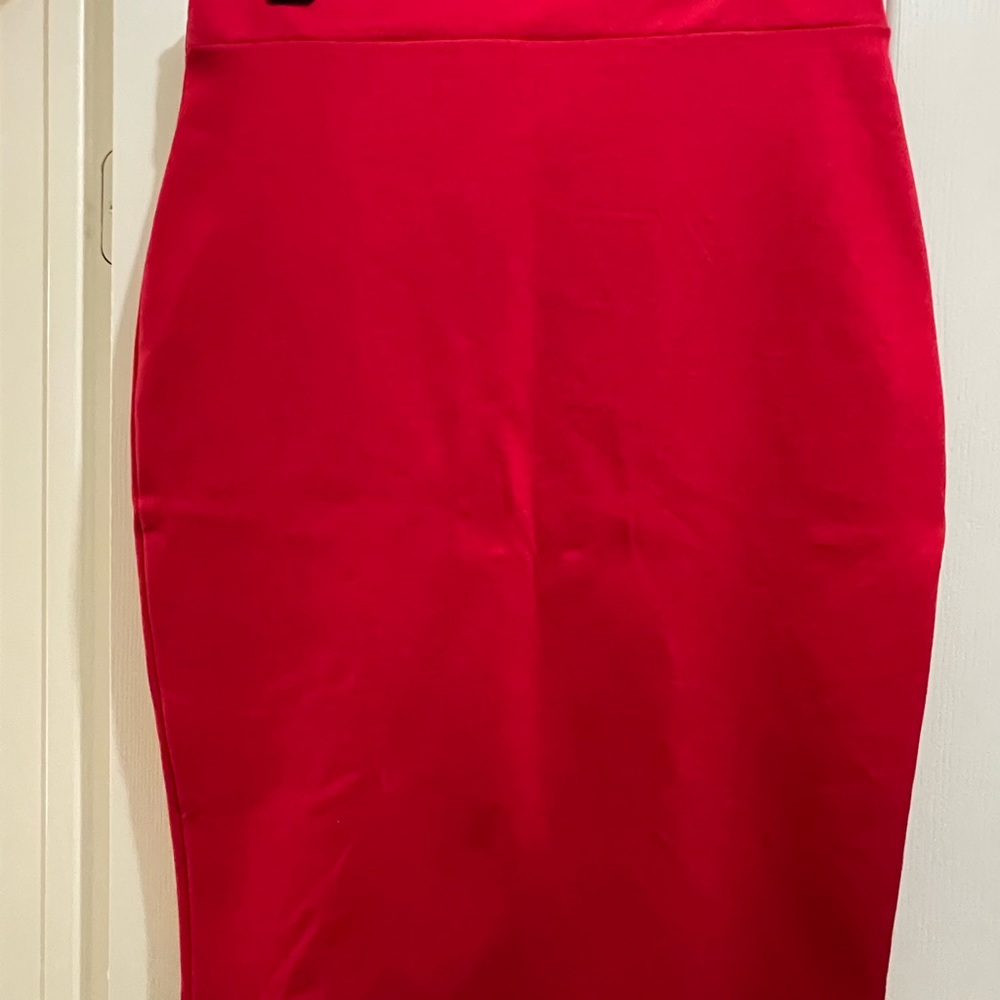 New with tags retro red pencil skirt with cute bow on back.